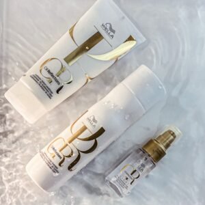 Elegant display of luxury hair products on water surface, capturing reflections and purity.