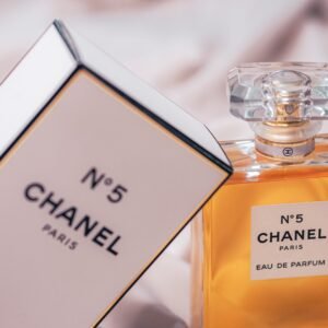 Chanel No.5 Eau de Parfum bottle and box beautifully displayed in a soft setting.