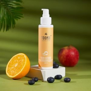 Facial cleanser with natural ingredients like orange, apple, and blueberries for healthy skin.